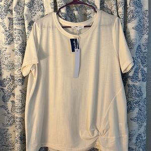 Short, sleeved, off-white blouse with a detail towards bottom